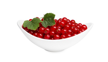 Photo of Many tasty fresh redcurrants and green leaves in bowl isolated on white