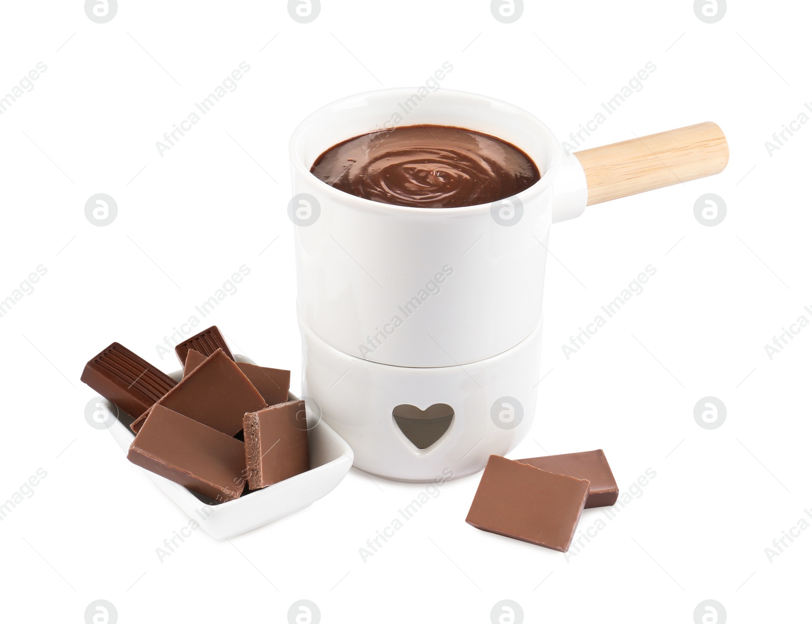 Photo of Fondue pot with melted chocolate and pieces of chocolate bar isolated on white