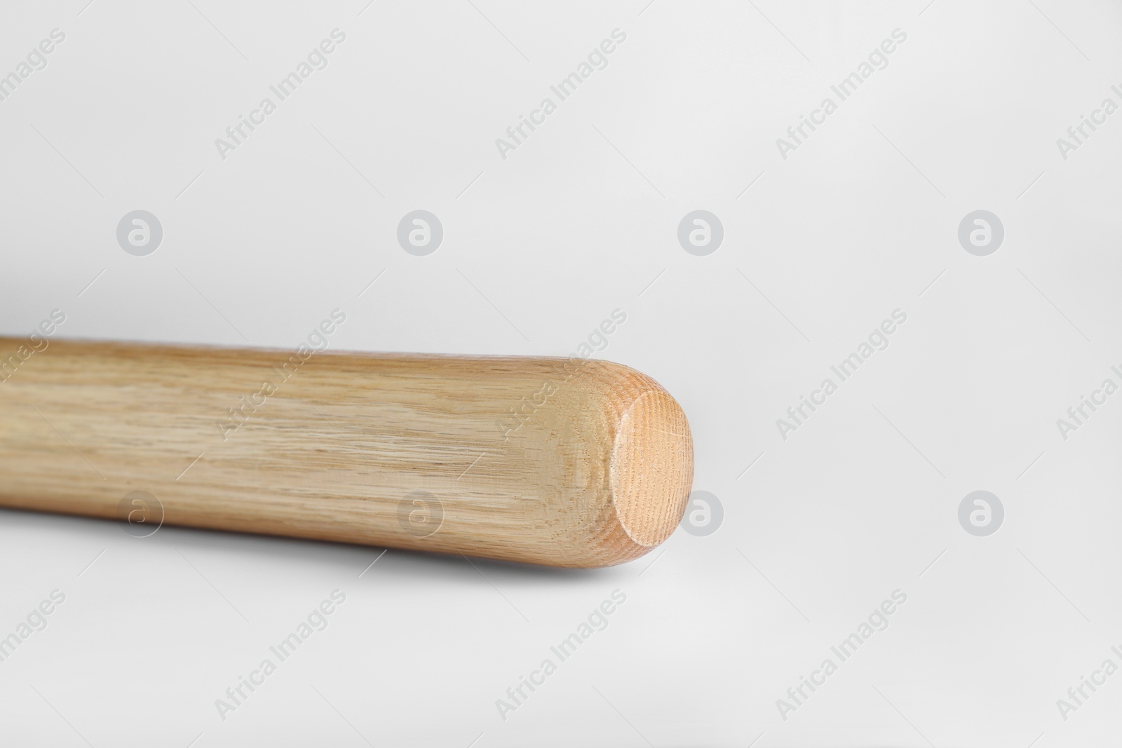 Photo of Wooden baseball bat on white background, space for text. Sports equipment