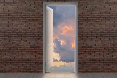 Image of Beautiful sunset sky visible through open door