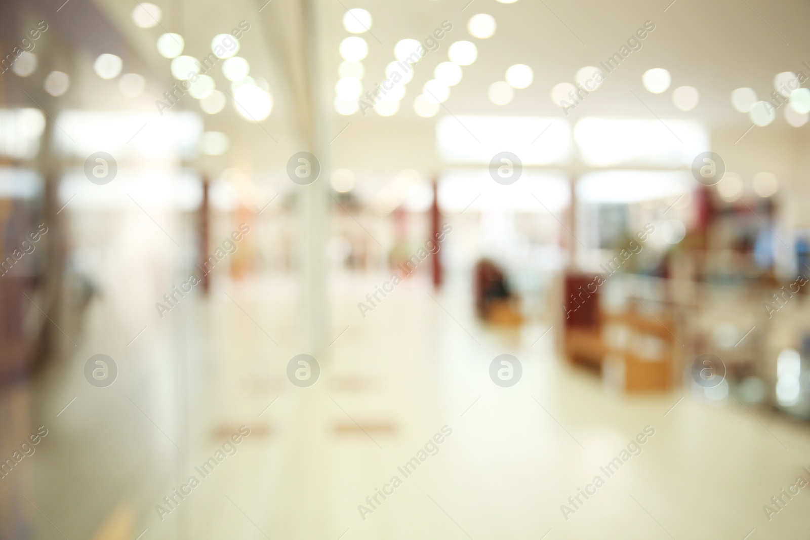 Photo of Blurred view of modern shopping mall interior