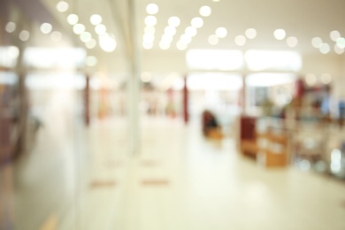 Blurred view of modern shopping mall interior