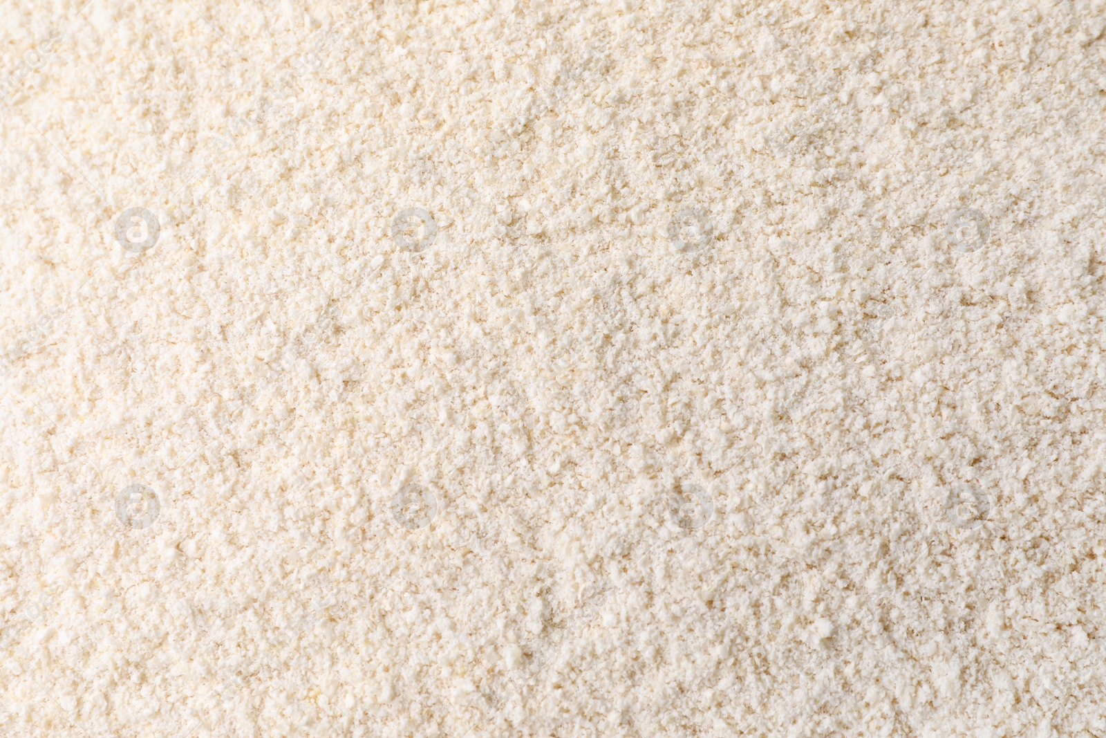 Photo of Heap of quinoa flour as background, closeup