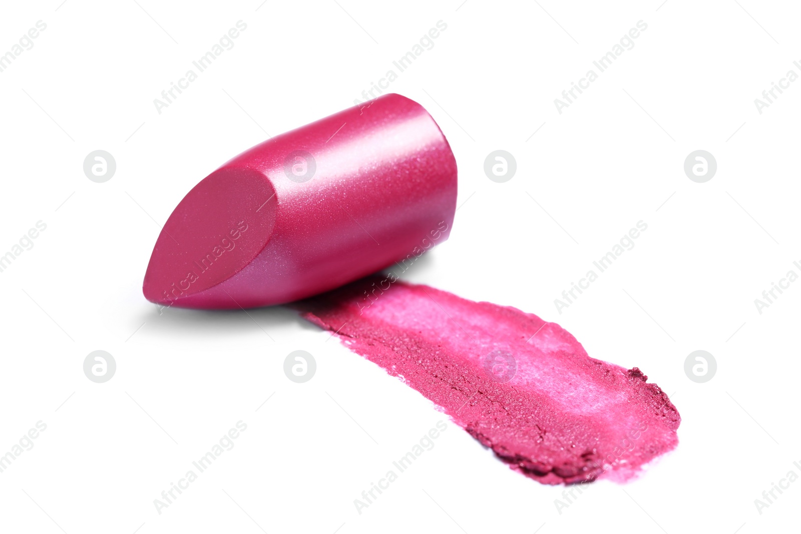 Photo of Bright lipstick and smear on white background