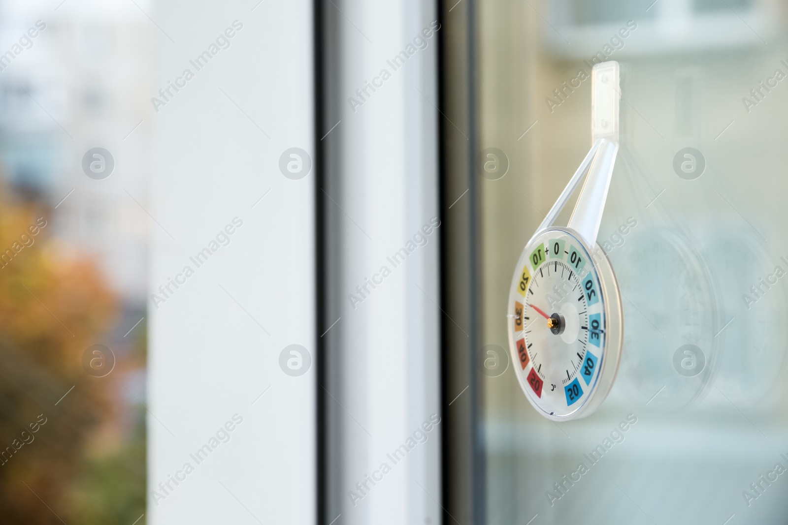 Photo of Weather thermometer on outside window. Space for text