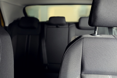 Photo of Car seat with grey upholstery, closeup view