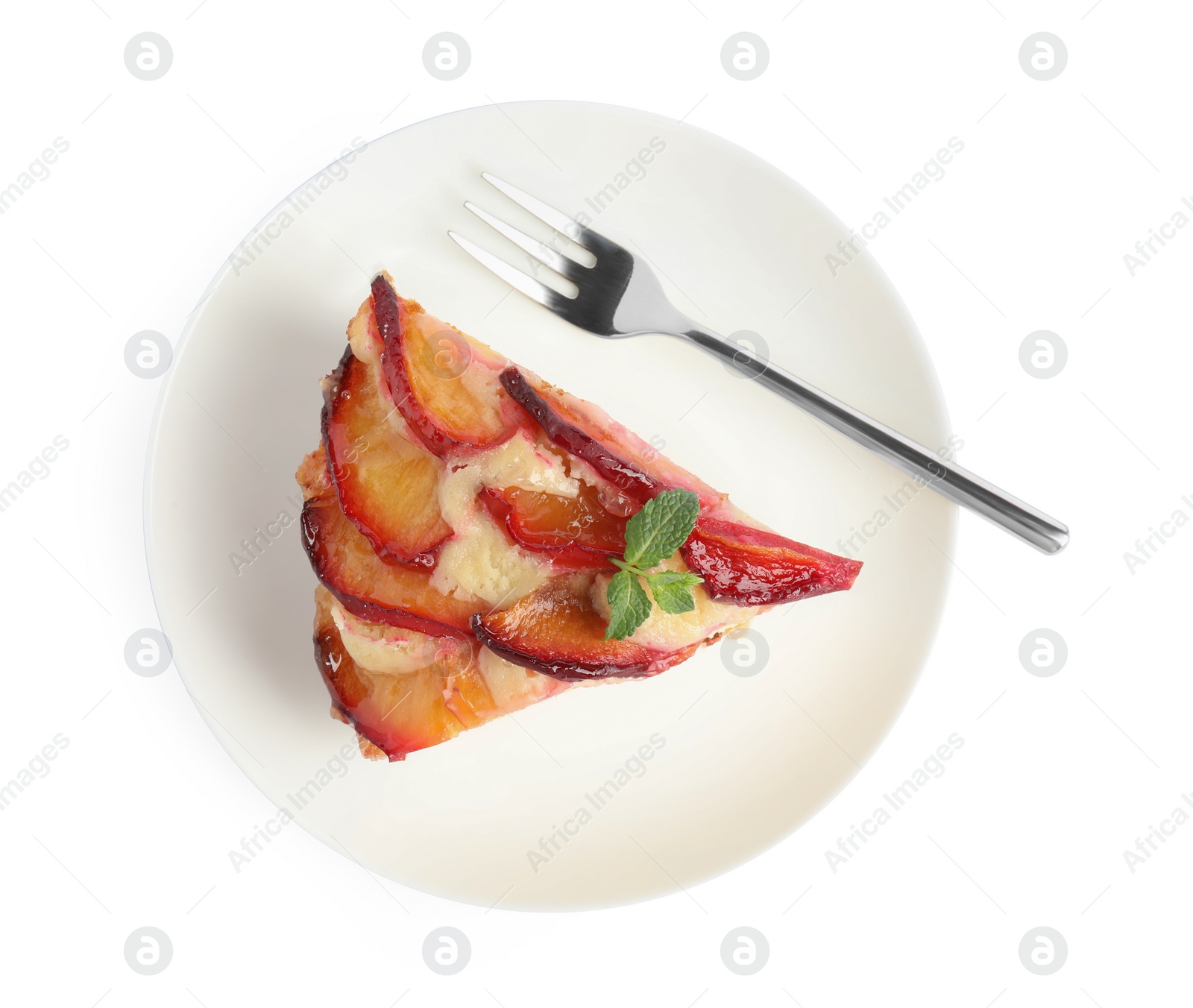 Photo of Slice of delicious cake with plums isolated on white, top view