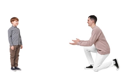 Image of Father reaching for his son on white background