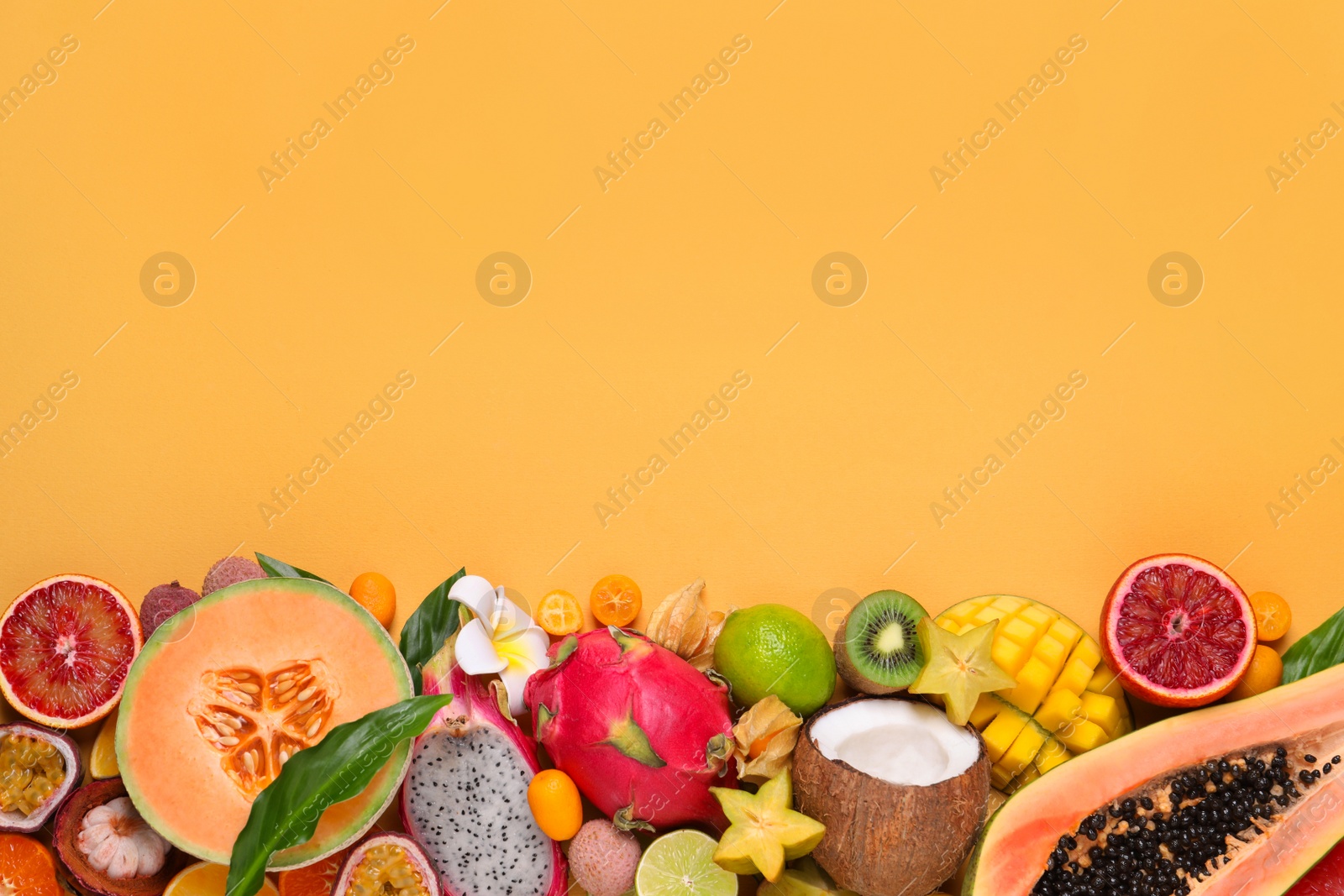 Photo of Different exotic fruits on beige background, flat lay. Space for text