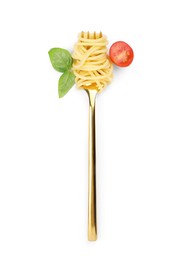 Photo of Fork with tasty pasta, fresh tomato and basil isolated on white, top view