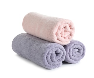 Photo of Fresh soft rolled towels isolated on white