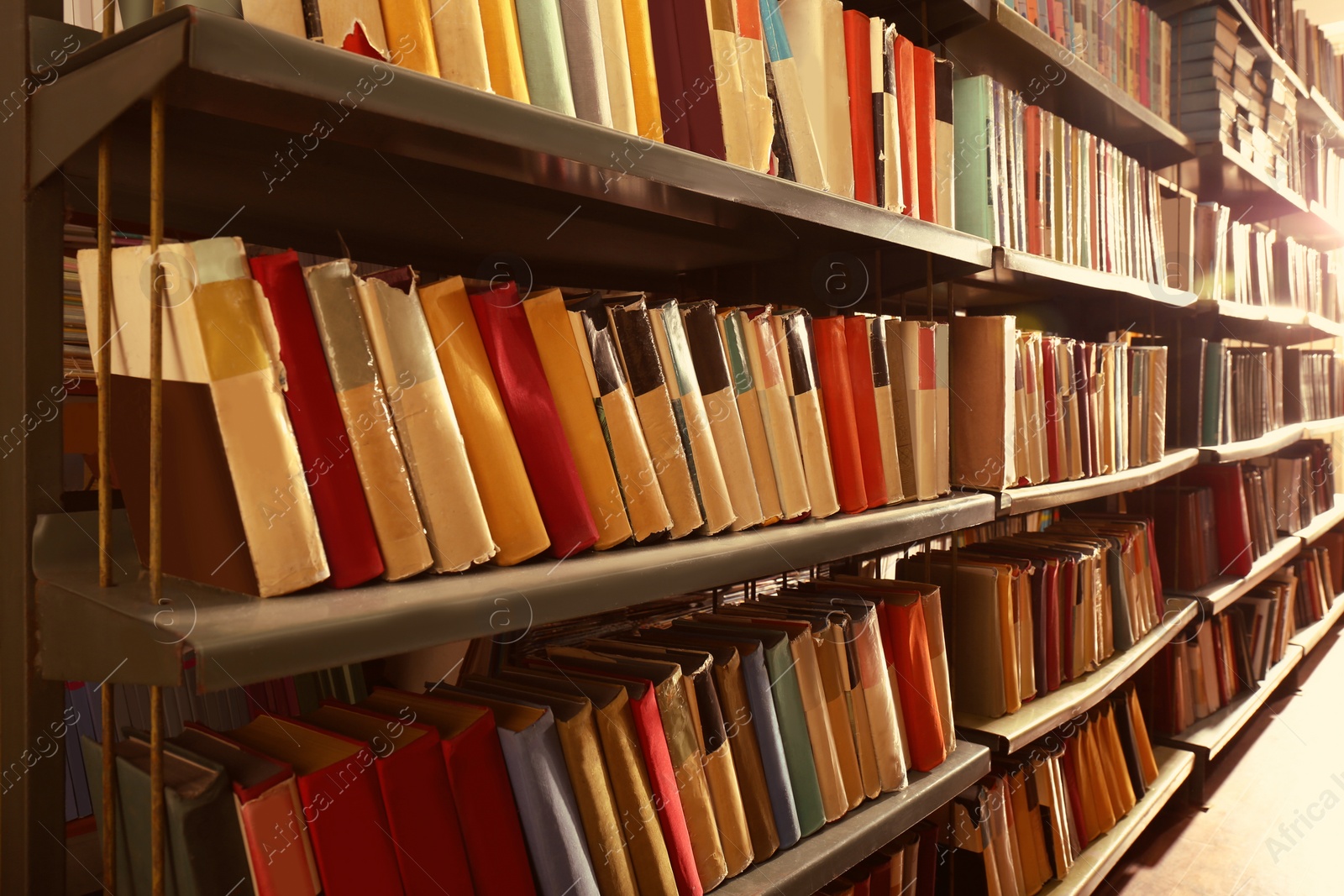 Image of Collection of different books on shelves in library