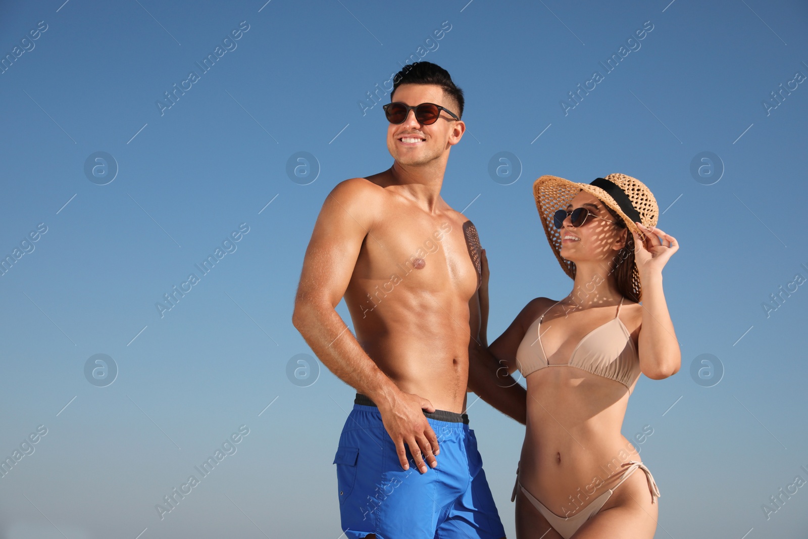Photo of Lovely couple spending time together against blue sky