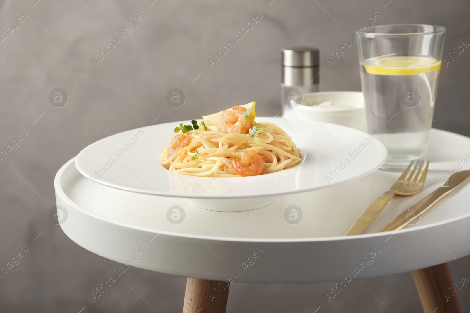 Photo of Delicious pasta with shrimps on plate