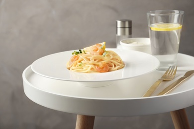 Delicious pasta with shrimps on plate