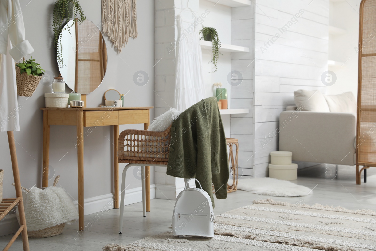 Photo of Wooden dressing table with decorative elements in room. Interior design