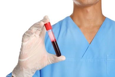 Photo of Male doctor holding test tube with blood sample on white background, closeup. Medical object