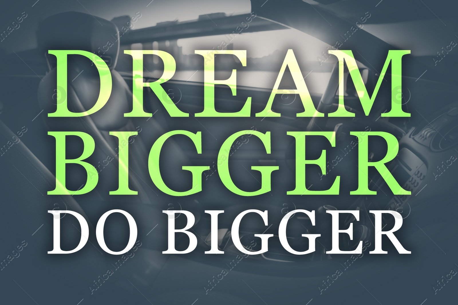 Image of Dream Bigger Do Bigger. Inspirational quote motivating to set life goals freely and forget about reasons that can hold back. Text against luxury car interior