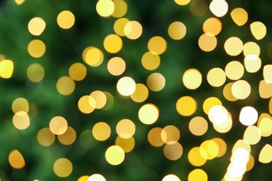 Photo of Abstract background with blurred yellow Christmas lights, bokeh effect