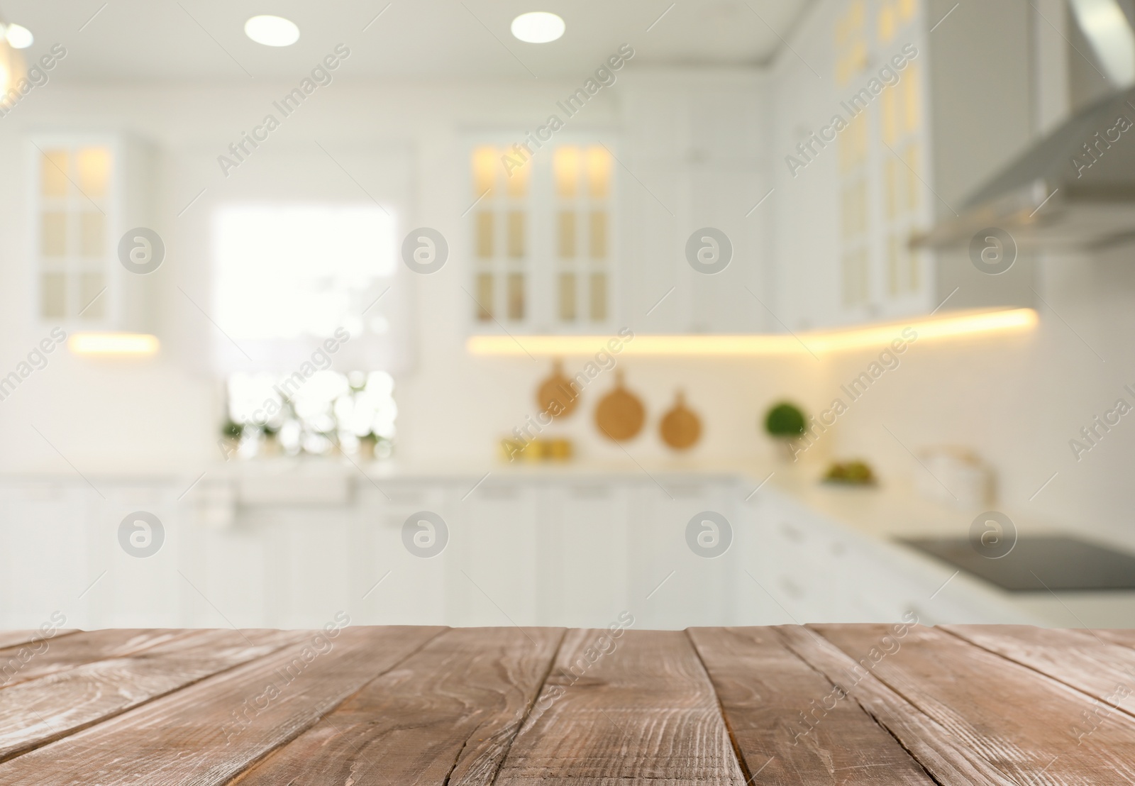 Image of Empty wooden table and blurred view of stylish kitchen interior. Mockup for design