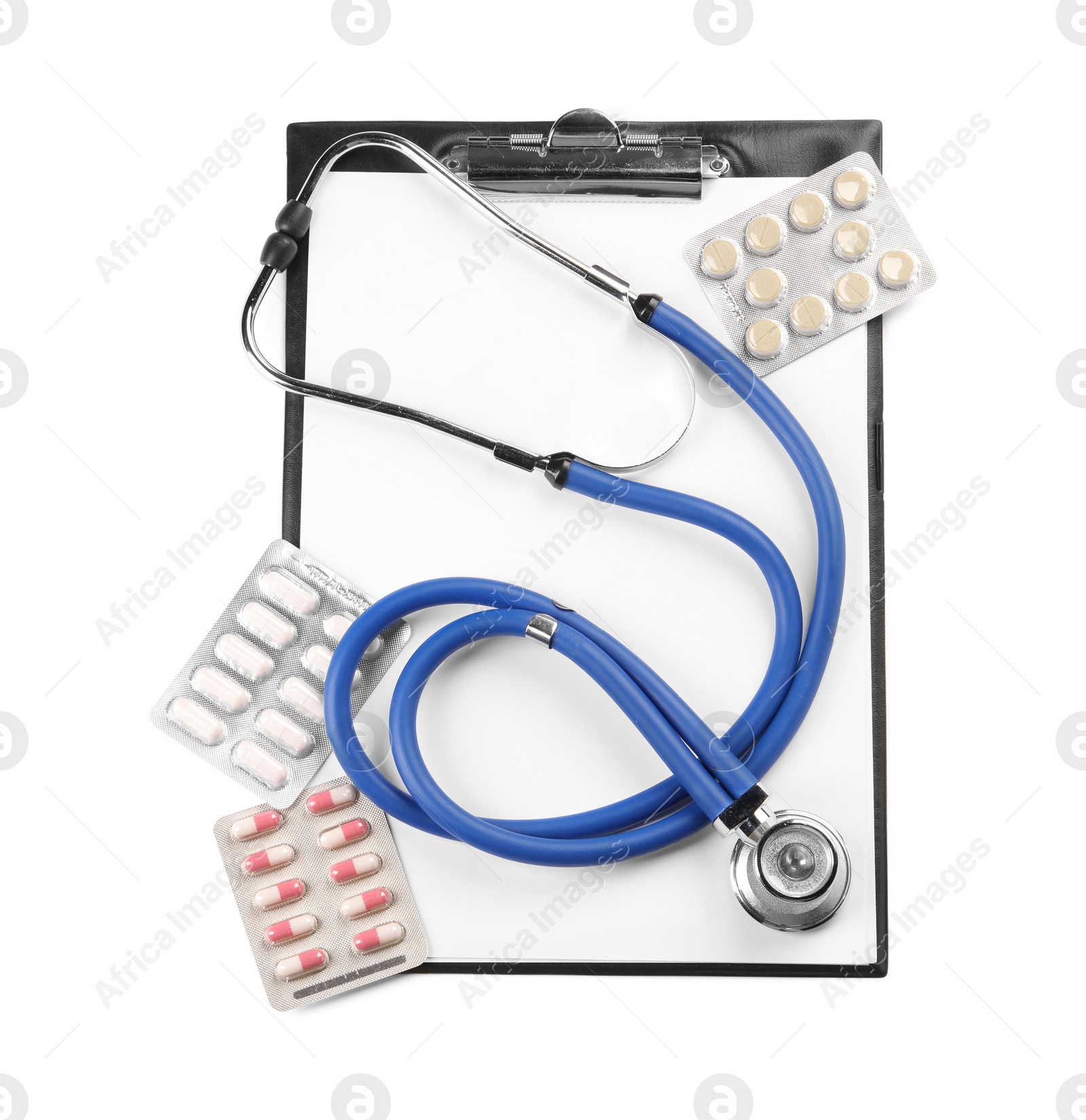 Photo of Stethoscope, pills and clipboard isolated on white, top view. Medical tool