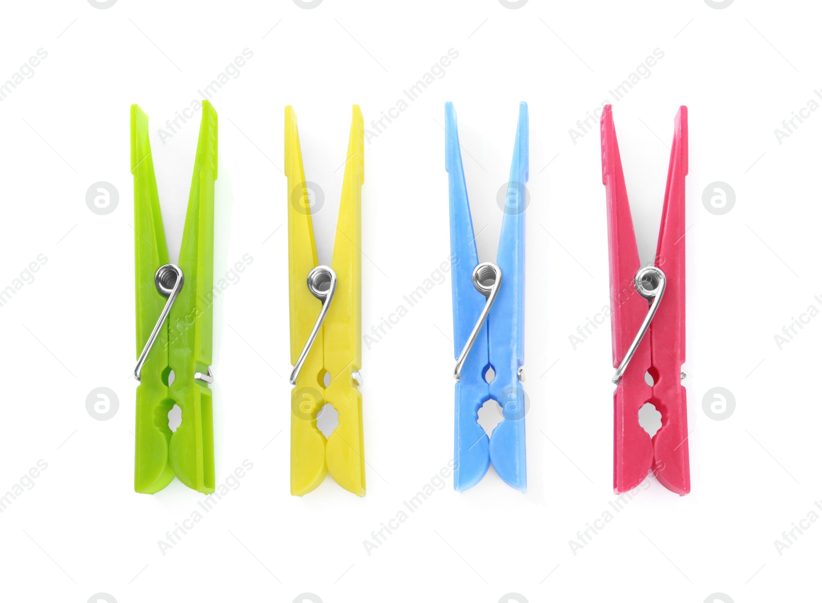 Photo of Colorful plastic clothespins on white background, top view