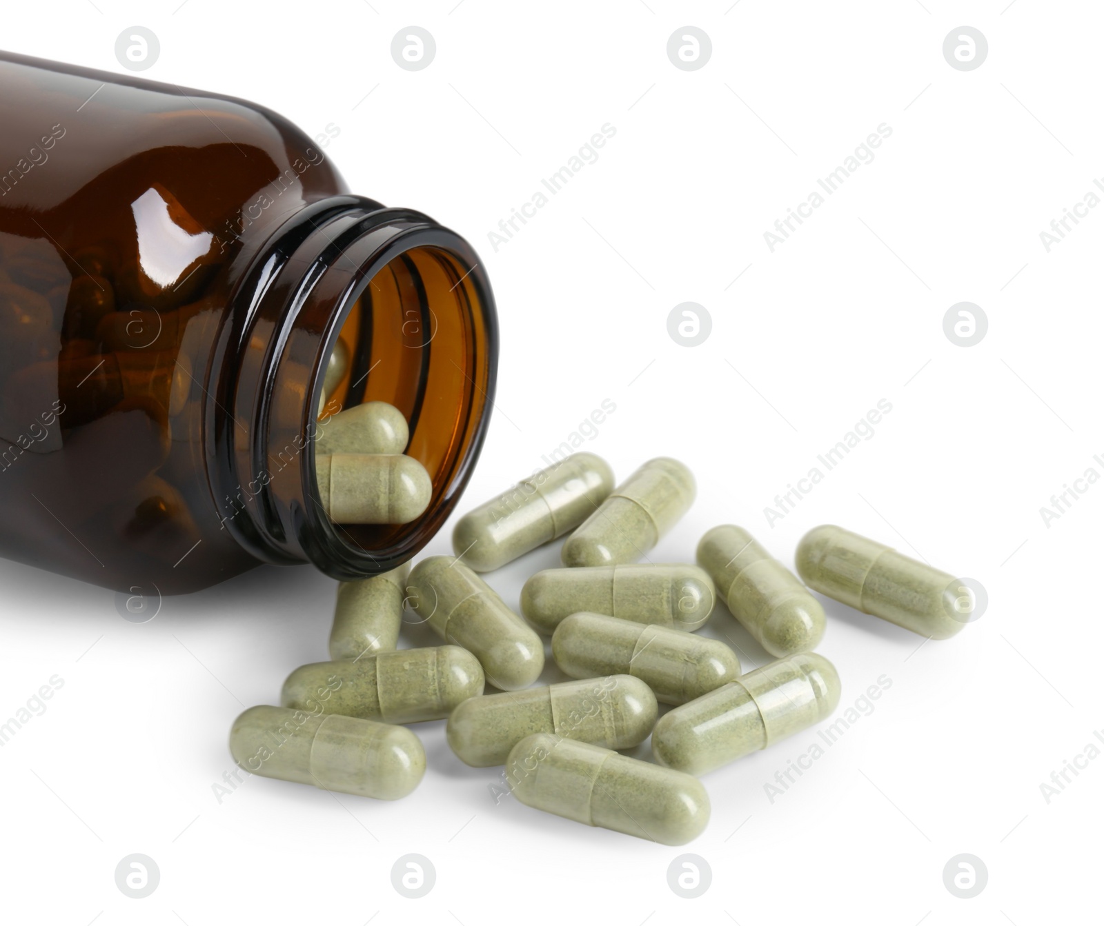 Photo of Scattered vitamin capsules and bottle isolated on white