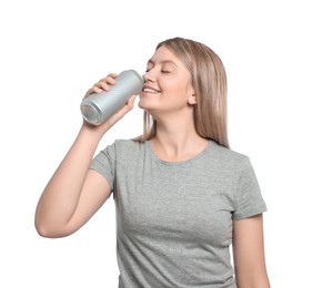 Beautiful woman drinking from beverage can on white background