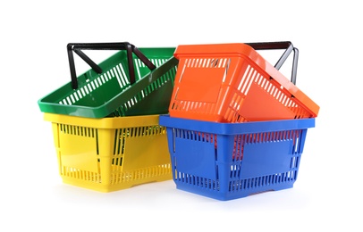 Colorful plastic shopping baskets on white background