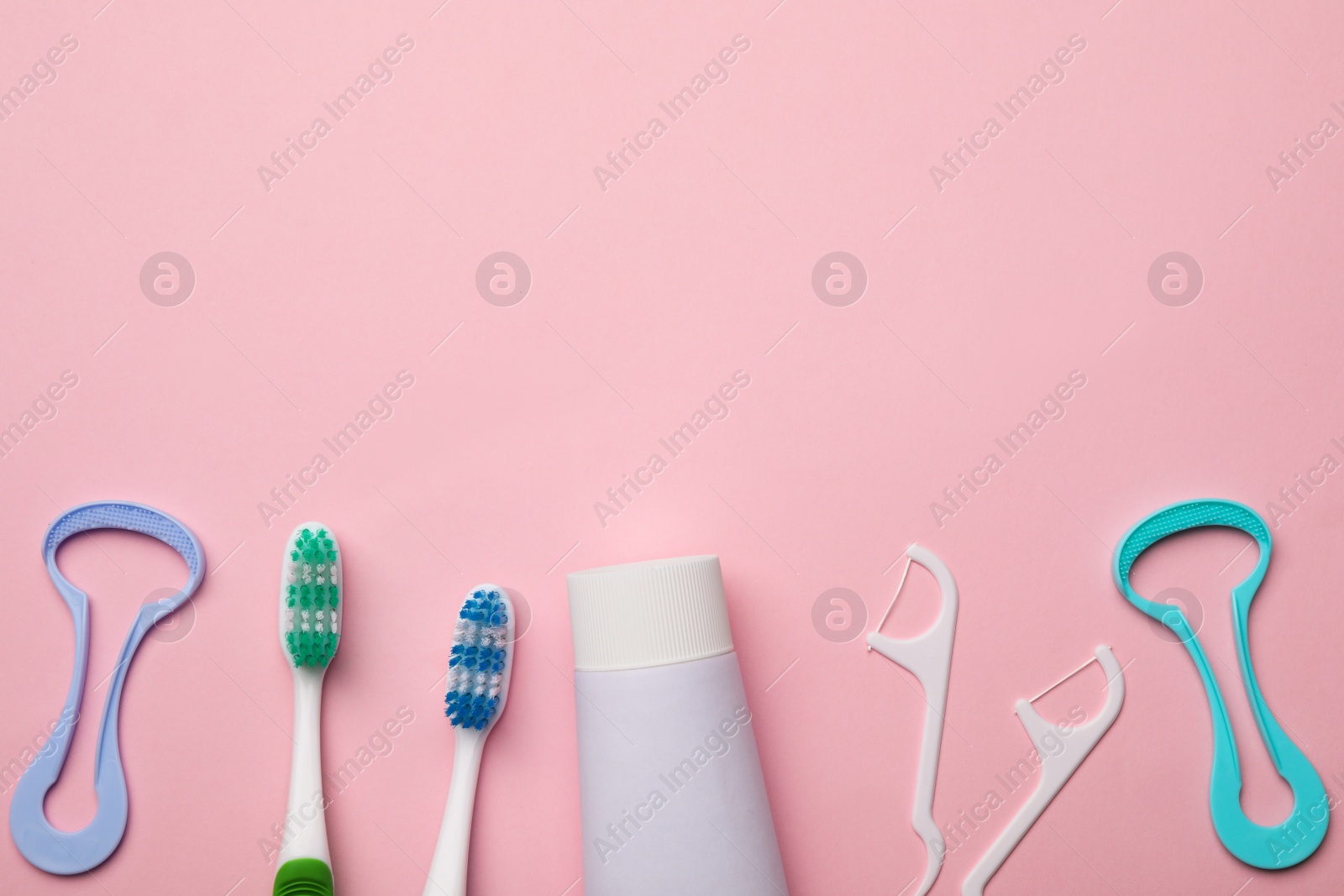 Photo of Flat lay composition with tongue cleaner on color background, space for text