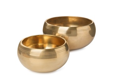 Two Tibetan singing bowls on white background