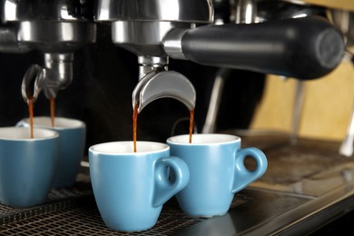 Photo of Making fresh aromatic espresso using professional coffee machine
