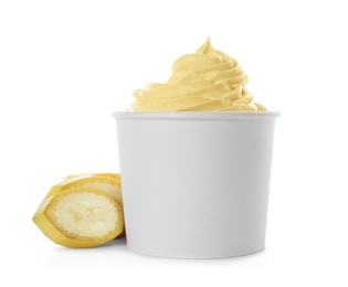 Cup of tasty frozen yogurt with banana on white background