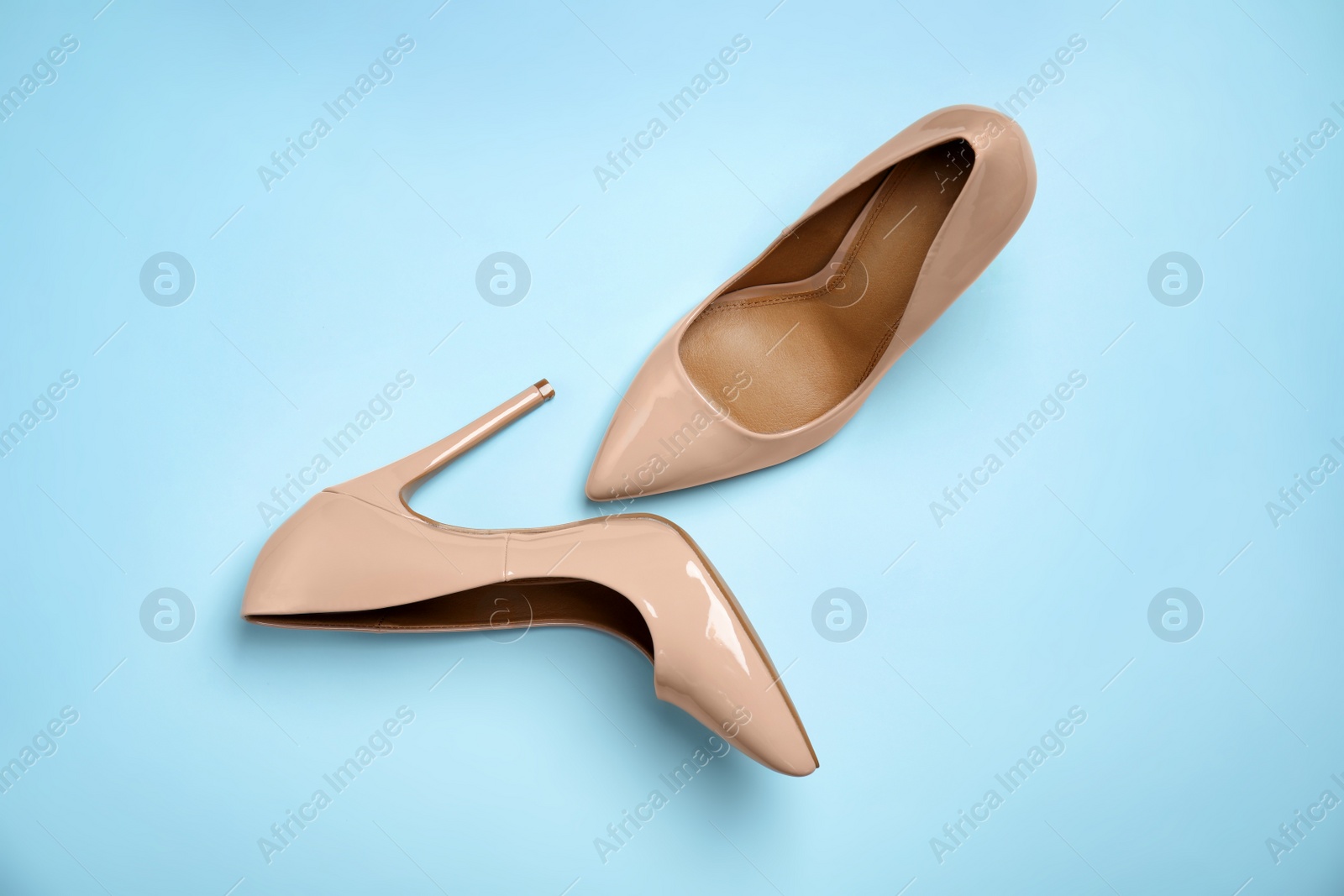 Photo of Pair of beautiful shoes on color background, top view