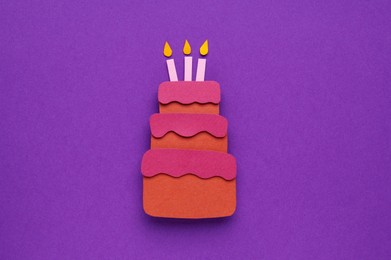 Photo of Birthday party. Paper cake on purple background, top view