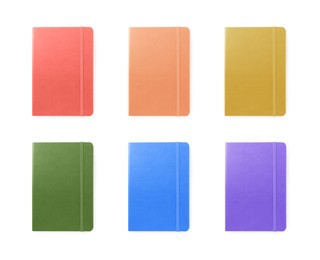 Image of Set with multicolor notebooks on white background, top view