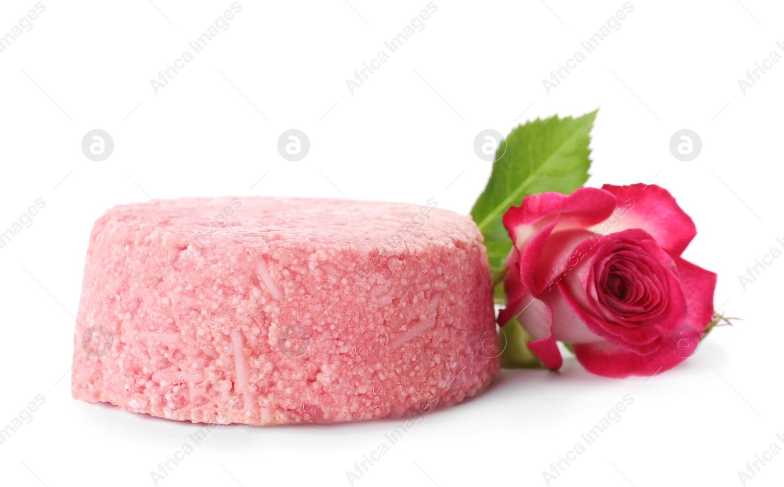Photo of Solid shampoo bar and rose on white background. Hair care
