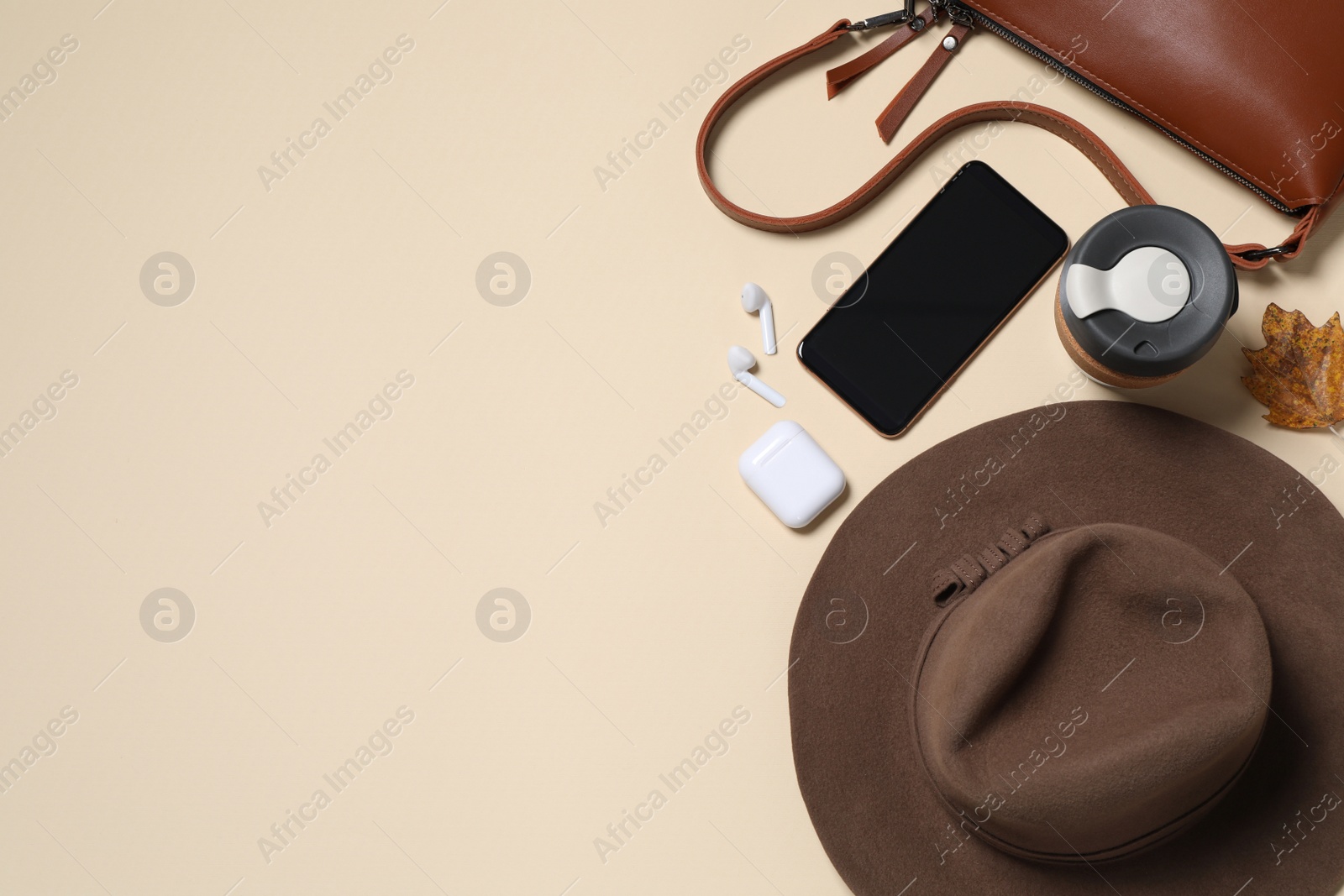 Photo of Flat lay composition with stylish hat on beige background, space for text