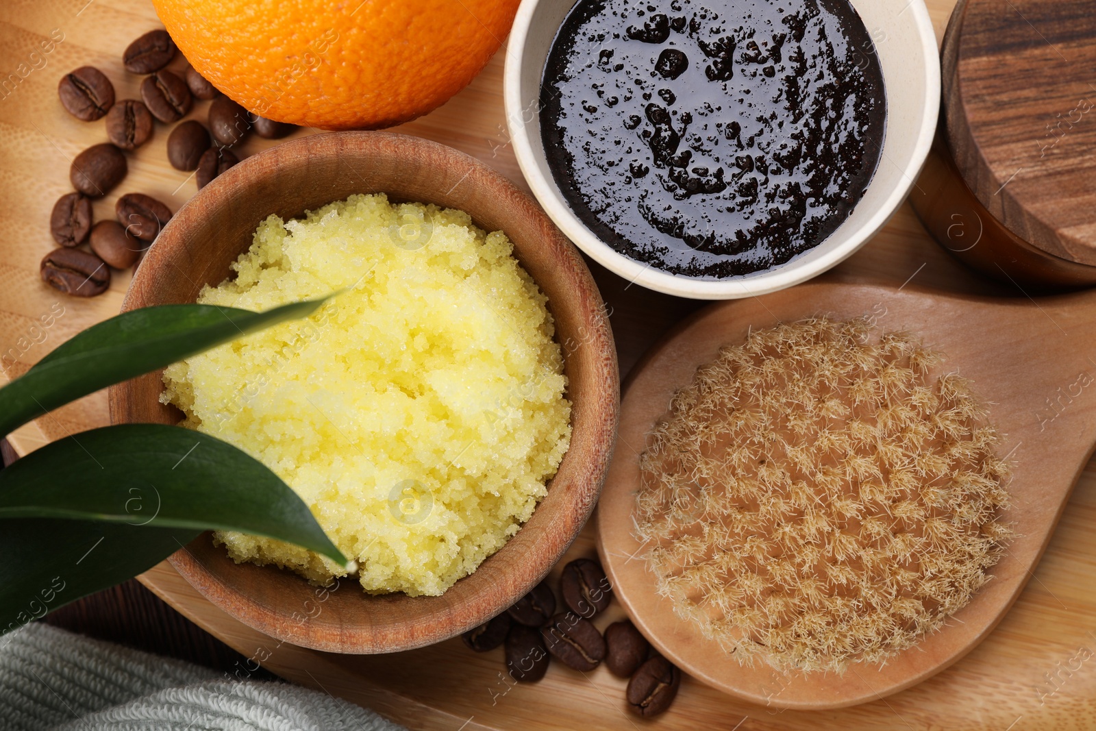 Photo of Flat lay composition with natural body scrubs on table. Anti cellulite treatment