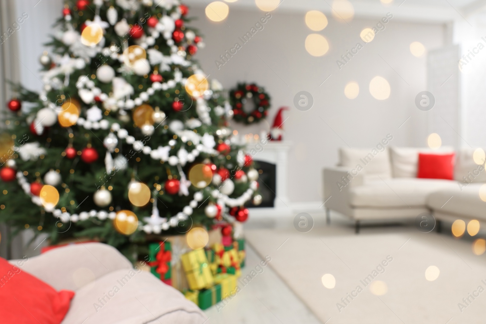 Photo of Blurred view of beautiful Christmas tree in stylish living room interior. Bokeh effect