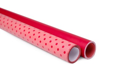 Photo of Rolls of colorful wrapping papers on white background
