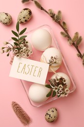 Photo of Flat lay composition with eggs, natural decor and word Easter on pink background. Happy celebration