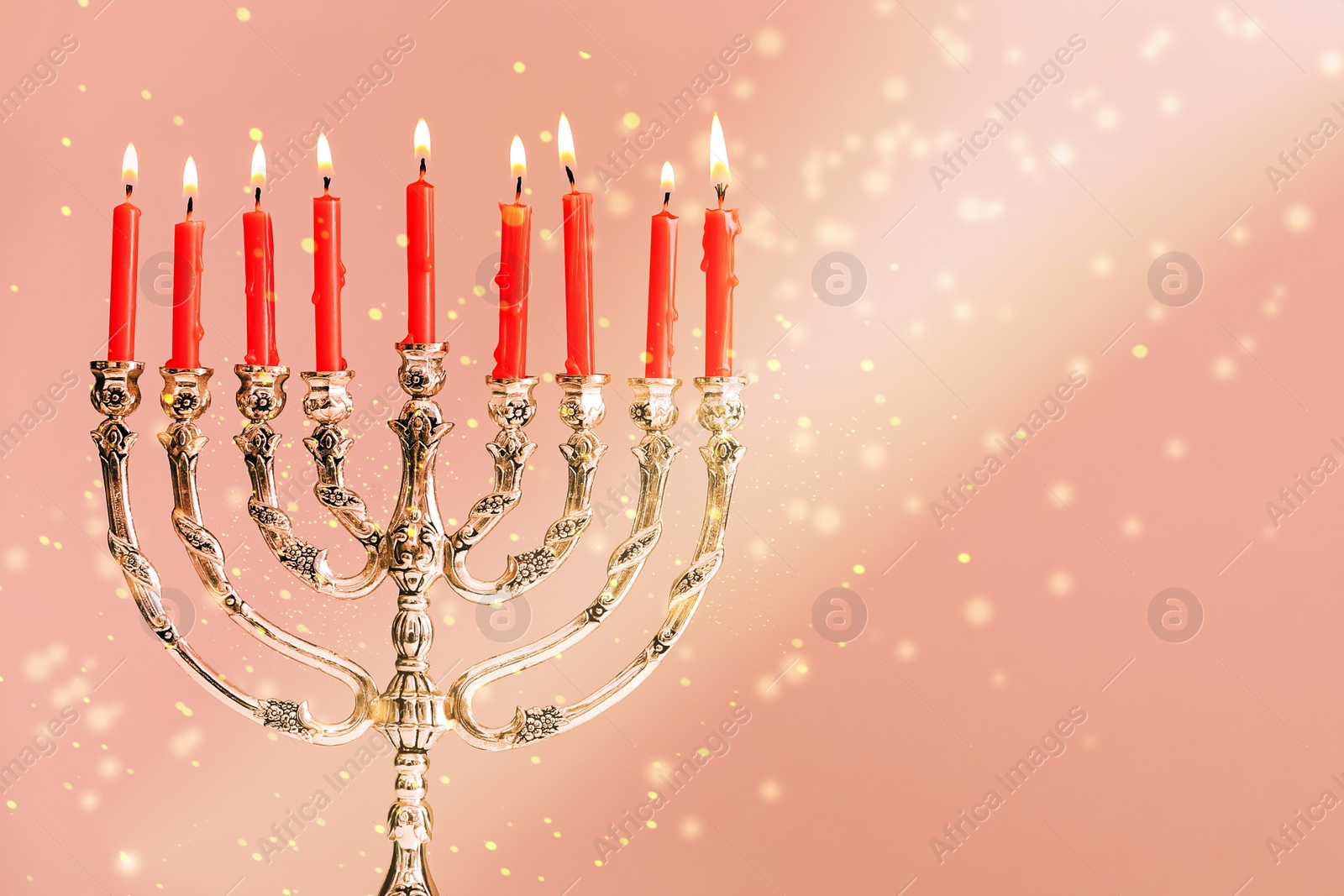 Image of Menorah with burning candles on color background, space for text. Hanukkah celebration