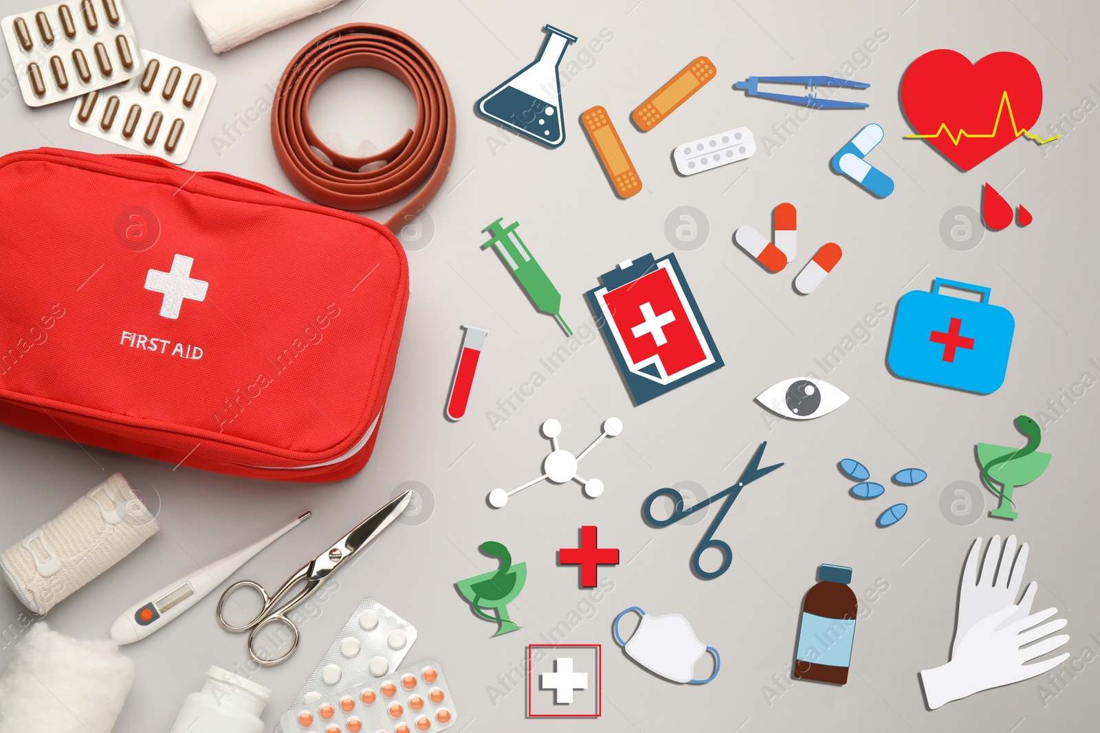 Image of First aid kit and different images on light grey background, flat lay