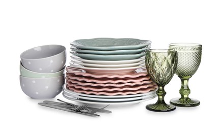 Photo of Set of beautiful ceramic dishware, glasses and cutlery isolated on white