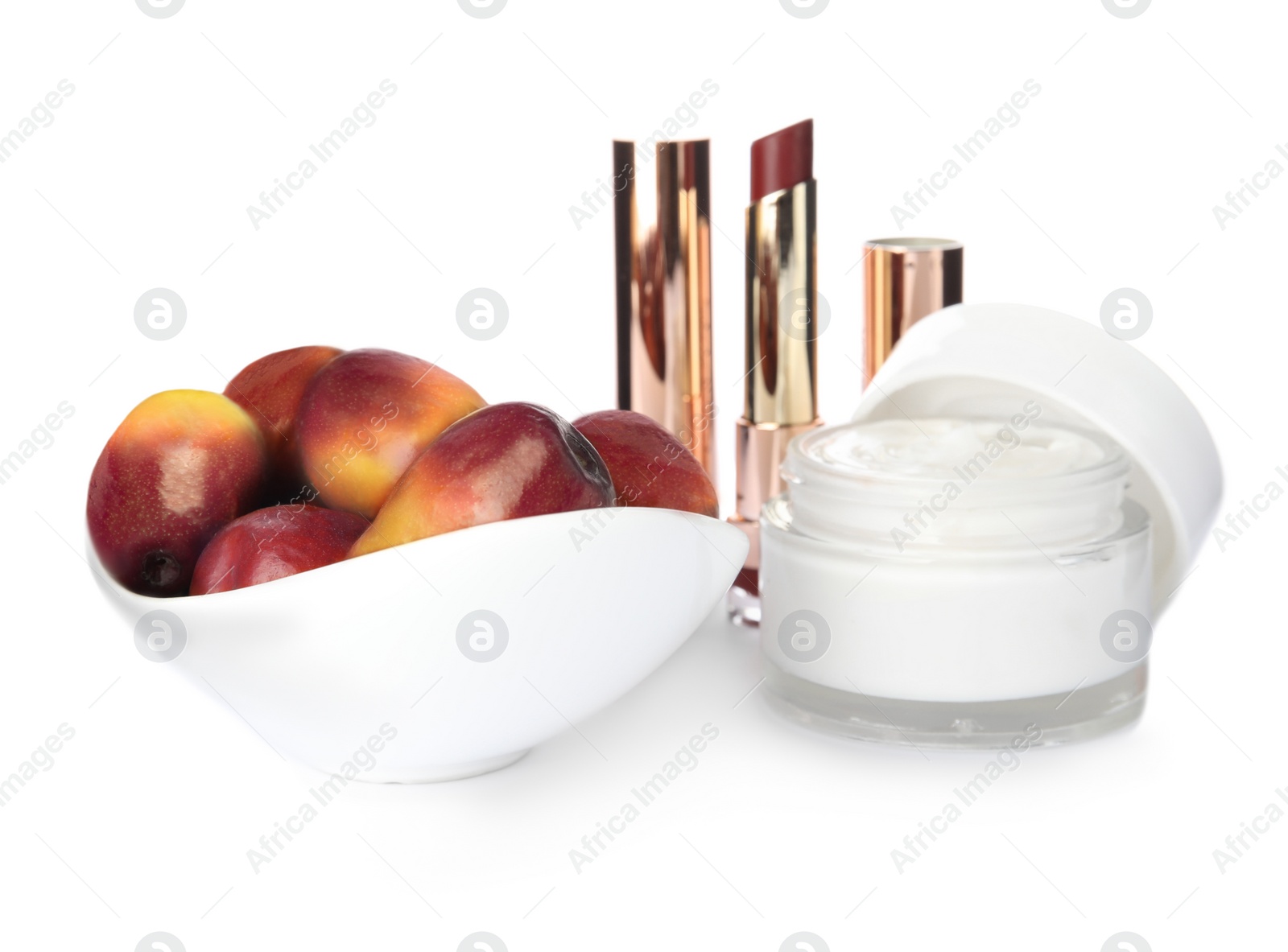 Image of Fresh ripe palm oil fruits and cosmetic products on white background