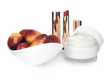 Image of Fresh ripe palm oil fruits and cosmetic products on white background