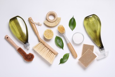 Photo of Flat lay composition with different cleaning supplies on white background