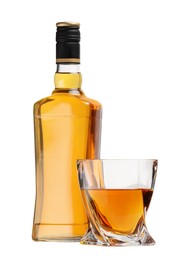 Glass and bottle of whiskey isolated on white