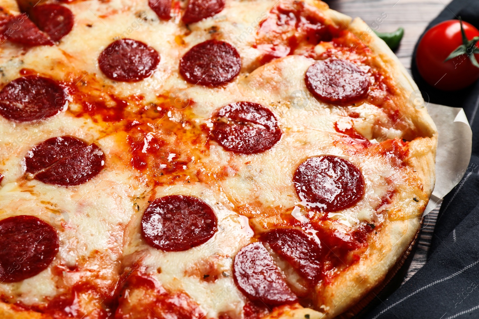 Photo of Hot delicious pepperoni pizza on table, closeup